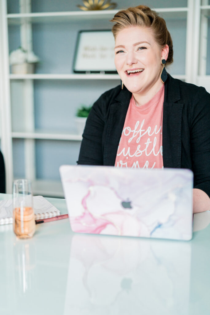 A woman working diligently at her desk with a laptop, showcasing a professional and organized environment